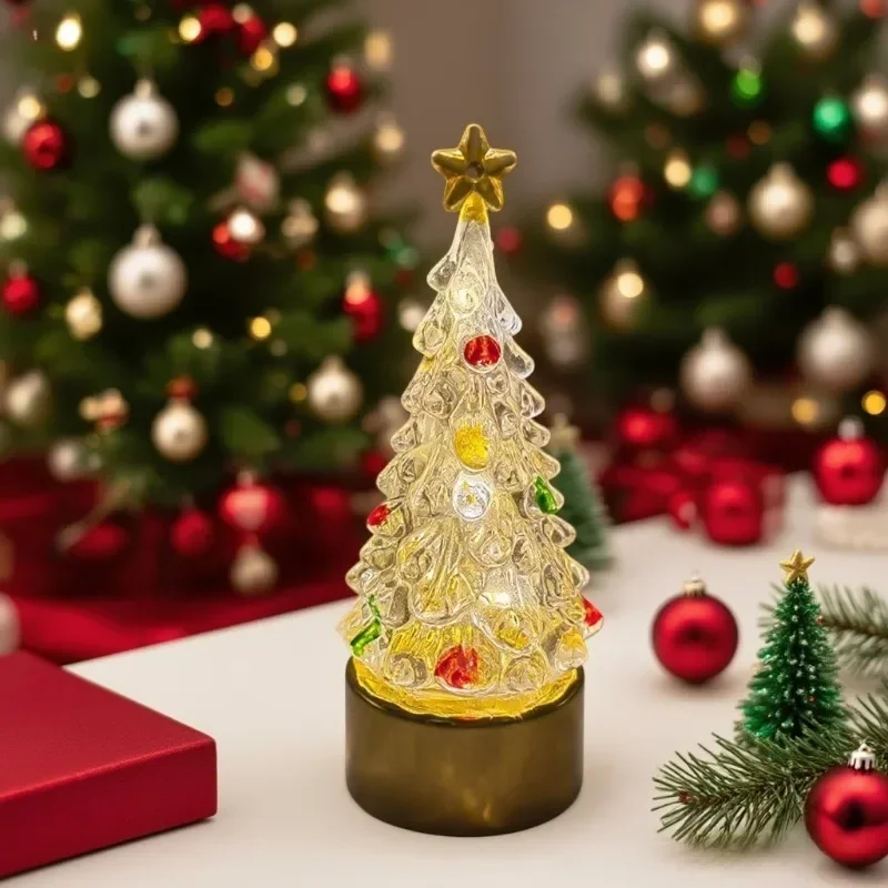 Small glowing Christmas tree lamp on a windowsill