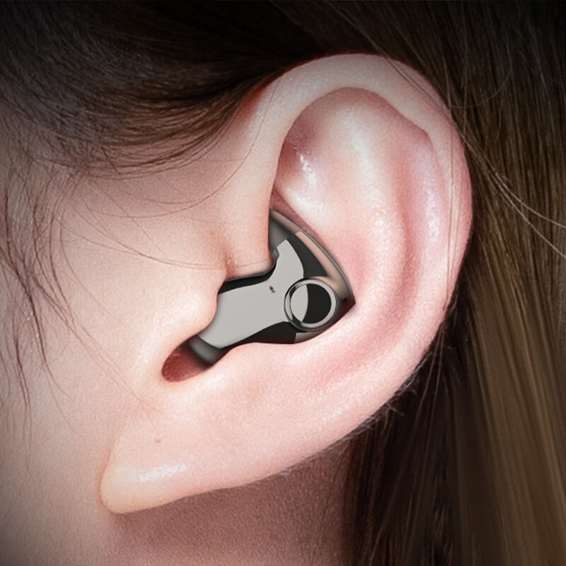 Pair of black wireless sleep earbuds resting inside their compact charging case on a plain background.