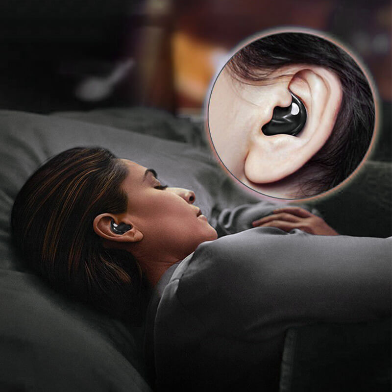 A person sleeping comfortably on their side wearing a mini Bluetooth sleep earbud.