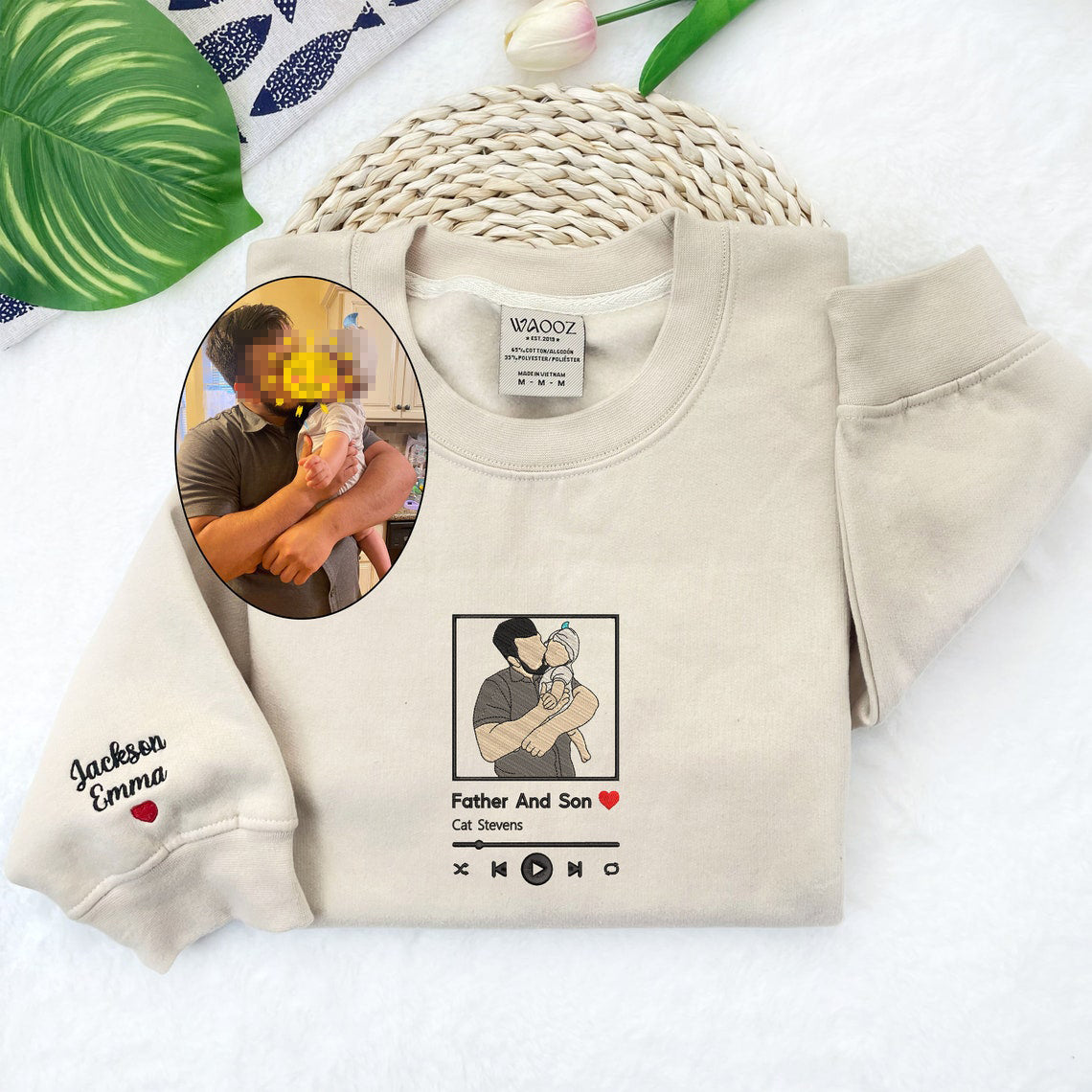 A person wearing a personalized embroidered hoodie showing the detailed custom line art on the chest.
