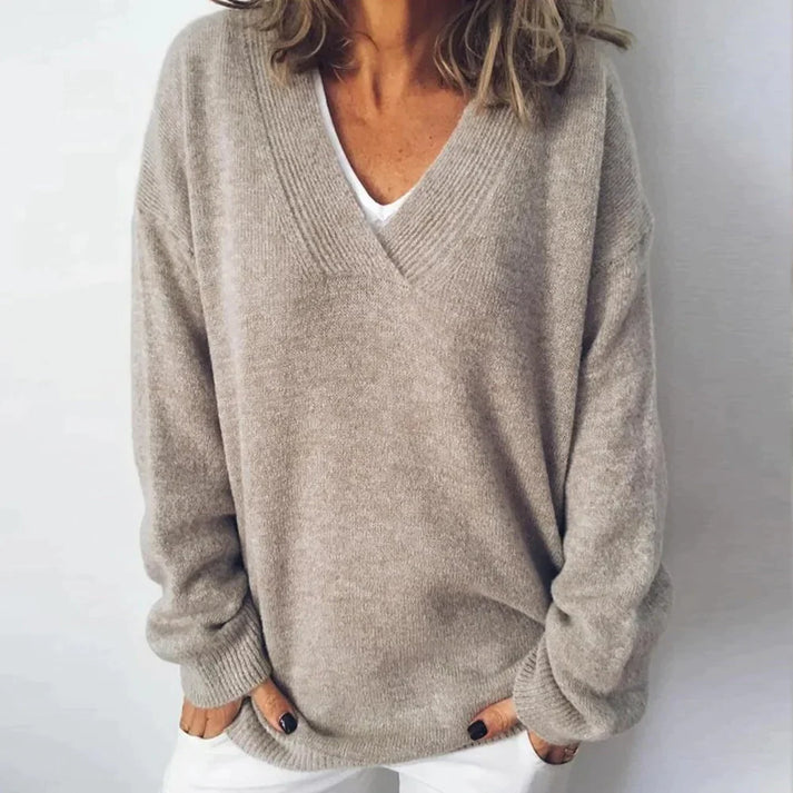 Woman wearing a relaxed cashmere V neck sweater