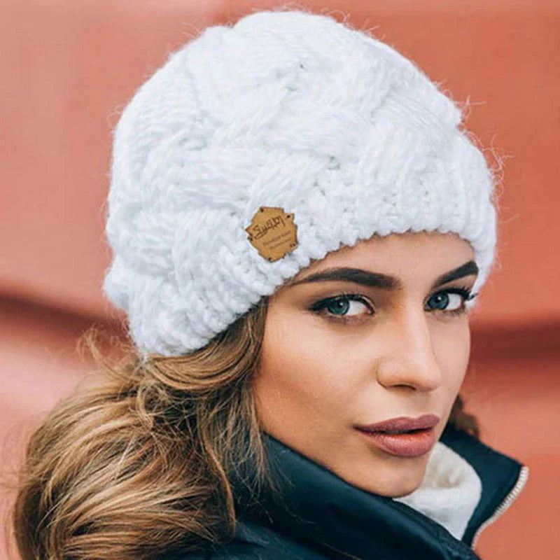 Woman wearing a chunky knit winter beanie outdoors