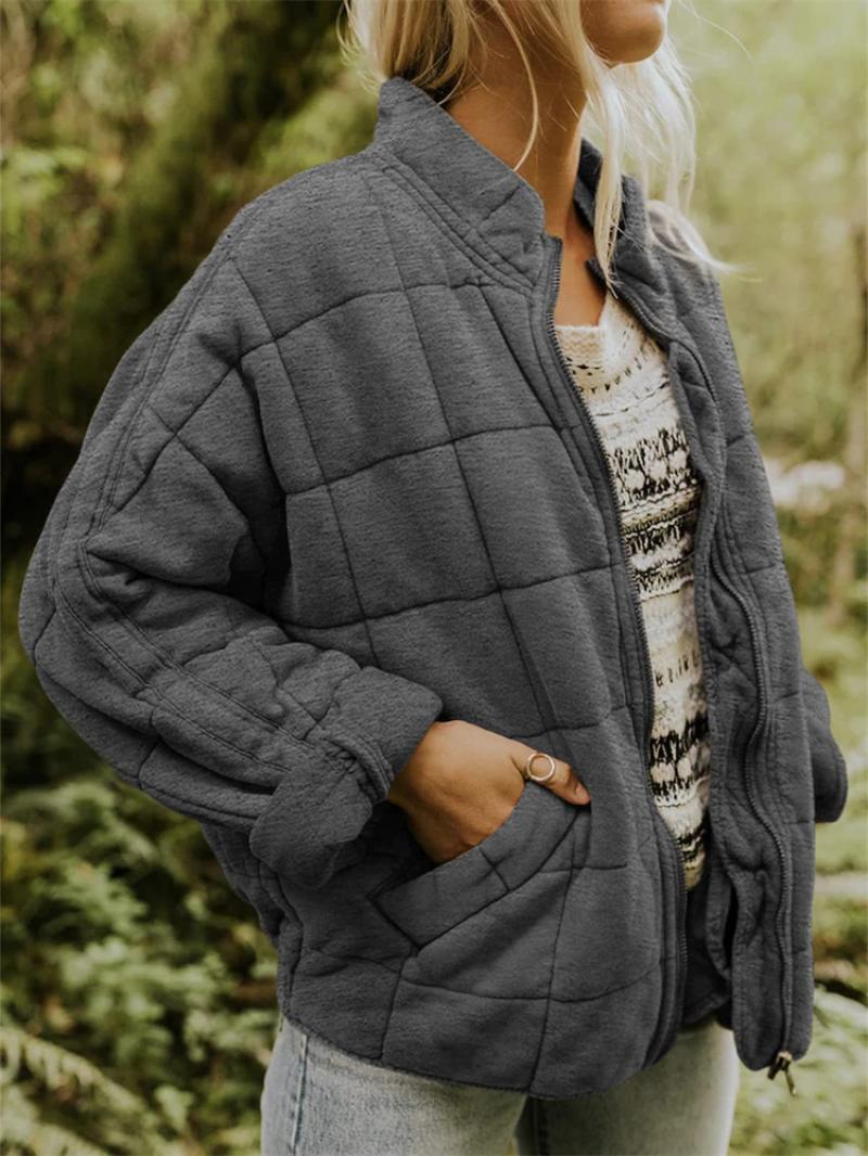 Woman wearing a lightweight slim fit quilted jacket