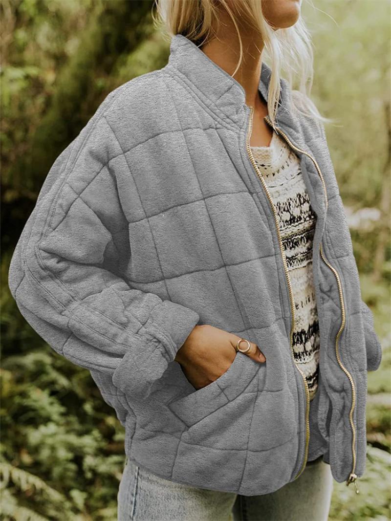 Detail of the quilting and full zipper on a women's jacket