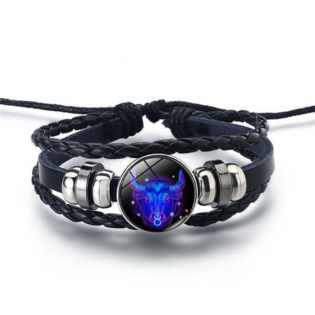 Close-up of the detailed steel alloy zodiac symbol bead on a blue sodalite stone bracelet.
